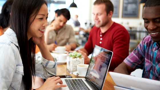 woman working on laptop  customer acquisition cost