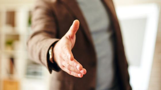 business man reaching to shake hand customer cac